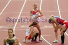 Helping hand at the end  of the 800 metres heptathlon at the Commonwealth Games, Glasgow. Photo: David T. Hewitson/Sports for All Pics